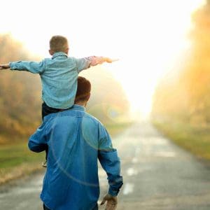 happy father and son walk in nature